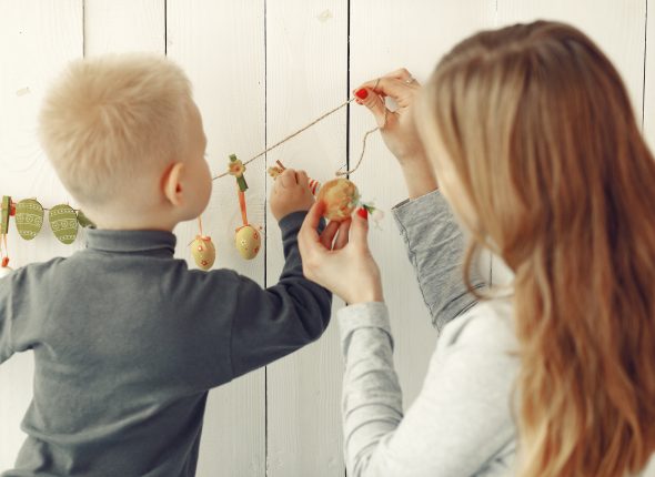Mother and little son playing at home